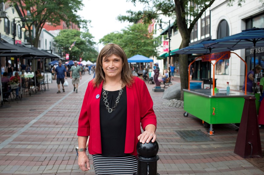 FILE PHOTO: Vermont Democratic Party gubernatorial primary candidate Christine Hallquist, a transgender woman, poses as she campaigns on Church Street in Burlington, Vermont, U.S., August 8, 2018. REU ...