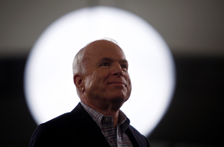 FILE PHOTO - U.S. Republican presidential nominee Sen. John McCain (R-AZ) smiles during a rally in Concord, North Carolina October 18, 2008. REUTERS/Carlos Barria/File Photo