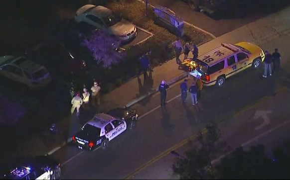 In this image made from aerial video, police vehicles line a road in the vicinity of a shooting in Thousand Oaks, California, early Thursday, Nov. 8, 2018. Authorities say there were multiple injuries ...