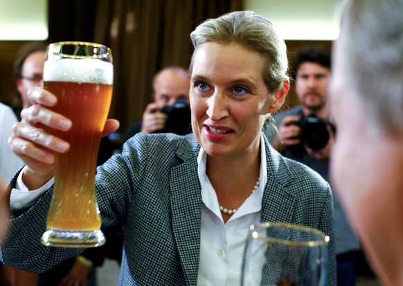 Alice Weidel of the anti-immigration party Alternative for Deutschland (AfD) salutes with a bavarian wheat beer during the Bavarian state election in Mamming near Dingolfing, Germany, October 14, 2018 ...