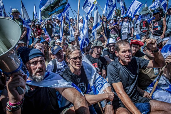 July 24, 2023, Jerusalem, Israel: Shikma Bressler, center, sits among a crowd of protestors, during an anti-judicial overhaul demonstration out side the Knesset Israels Parliament in Jerusalem. Israel ...