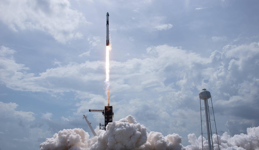 May 30, 2020, Cape Canaveral, Florida, USA: In this photo released by the National Aeronautics and Space Administration NASA, a SpaceX Falcon 9 rocket carrying the company s Crew Dragon spacecraft is  ...