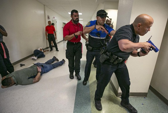 North Miami Police Department and Miami-Dade County Public Schools Police take part in an active shooter drill at North Miami Senior High on Tuesday, July 24, 2018. (Al Diaz/Miami Herald/TNS) Photo vi ...
