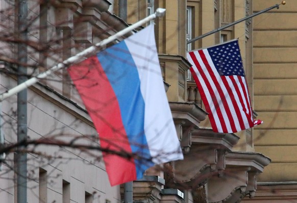 MOSCOW, RUSSIA - APRIL 21, 2021: Flags of Russia and the United Sates in Novinsky Boulevard in central Moscow. Seen behind is the US embassy. Vladimir Gerdo/TASS