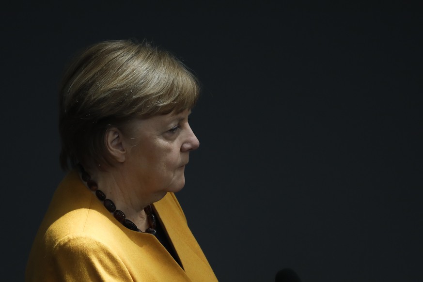 German Chancellor Angela Merkel answers questions from lawmakers at German parliament Bundestag in Berlin, Germany, Wednesday, March 24, 2021. (AP Photo/Markus Schreiber)