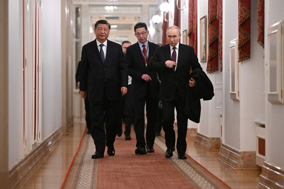 Chinese President Xi Jinping, left, and Russian President Vladimir Putin walk after their talks at the Kremlin in Moscow, Russia, Monday, March 20, 2023. (Grigory Sysoyev, Sputnik, Kremlin Pool Photo  ...