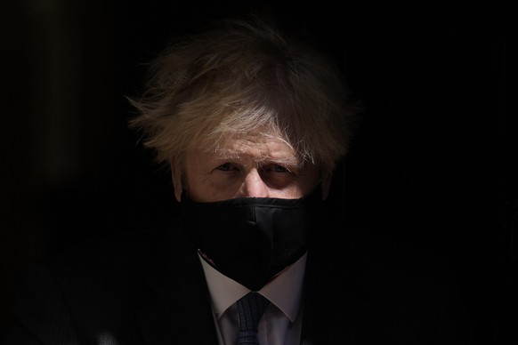 FILE - British Prime Minister Boris Johnson leaves 10 Downing Street to attend the weekly Prime Minister's Questions at the Houses of Parliament, in London, Wednesday, June 23, 2021. British media say ...