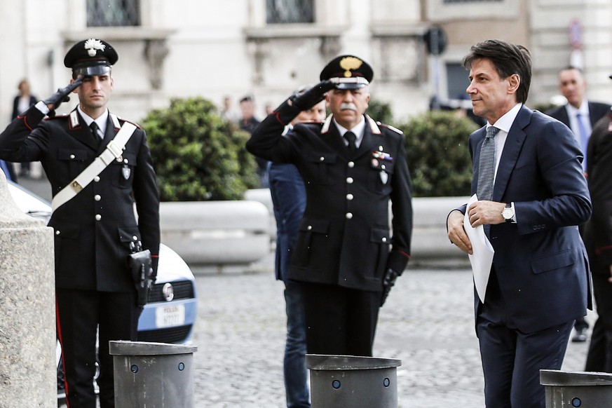 Giuseppe Conte, right, arrives to meet Italian President Sergio Mattarella at the Quirinale Palace in Rome, Wednesday, May 23, 2018. Italy's president summoned Giuseppe Conte for consultations Wednesd ...
