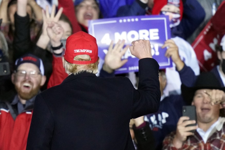 Supporters cheer as President Donald Trump arrives to speak at a campaign rally on Sunday, Nov. 1, 2020, at Richard B. Russell Airport in Rome, Ga. (AP Photo/Brynn Anderson)