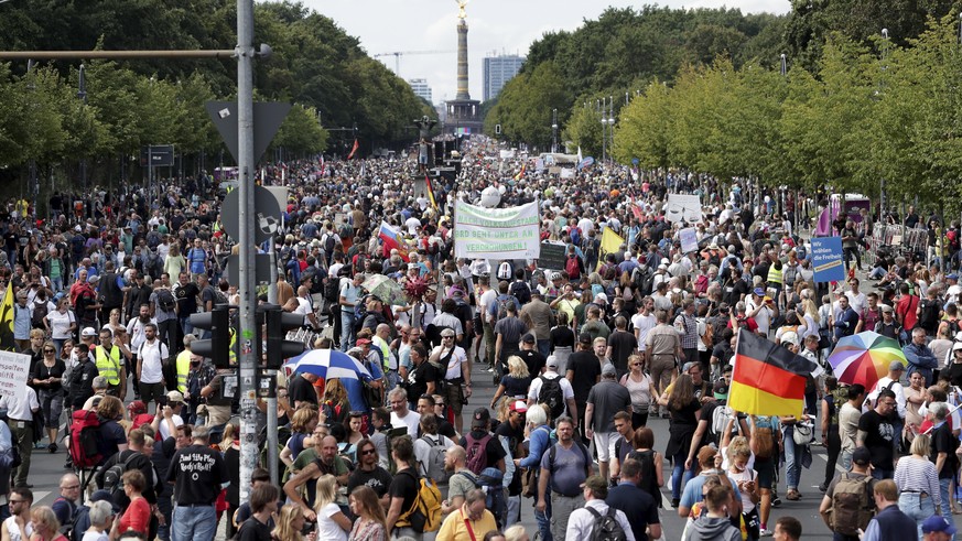 People attend a protest rally in Berlin, Germany, Saturday, Aug. 29, 2020 against new coronavirus restrictions in Germany. Police in Berlin have requested thousands of reinforcements from other parts  ...