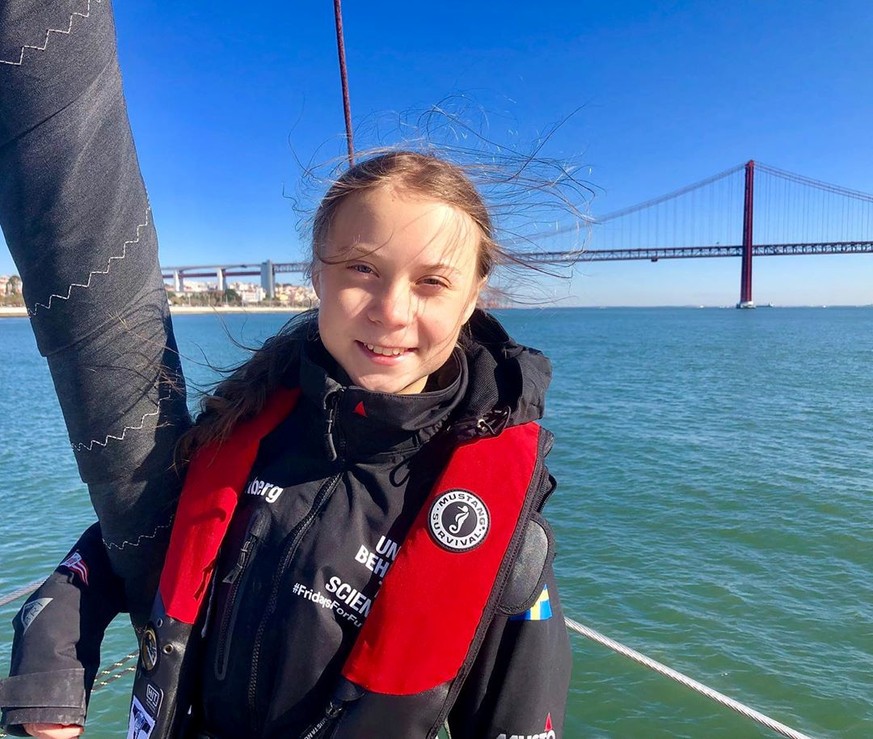 Climate change activist Greta Thunberg poses on the yacht, La Vagabonde, before arriving in Lisbon, Portgual December 3, 2019 in this image obtained from social media. Greta Thunberg Media via REUTERS ...