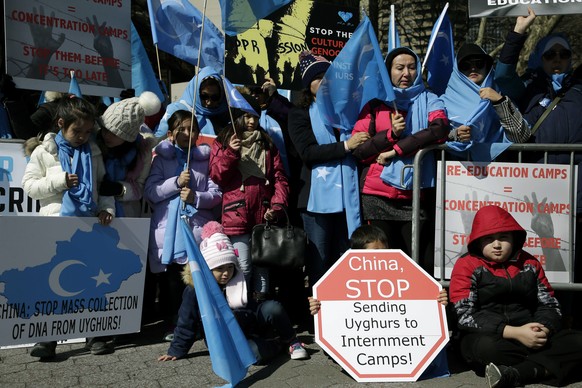 Uighurs and their supporters rally across the street from United Nations headquarters in New York, Thursday, March 15, 2018. Members of the Uighur Muslim ethnic group held demonstrations in cities aro ...