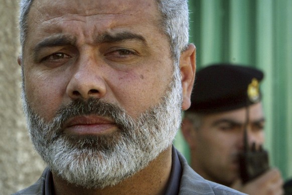 FILE - Palestinian Hamas leader Ismail Haniyeh speaks to the media after his meeting with Egyptian officials at the Egyptian diplomatic mission in Gaza City, Feb. 10, 2006. (AP Photo/Adel Hana, File)