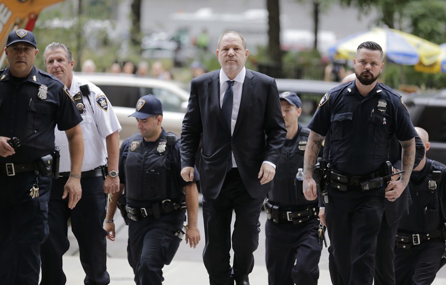Harvey Weinstein, center, arrives to court in New York, Thursday, Oct. 11, 2018. Weinstein is set to appear before a judge as his lawyers try to get the charges dismissed in his criminal case. (AP Pho ...