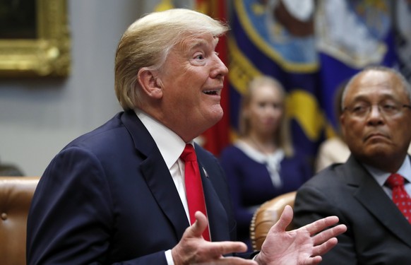 President Donald Trump, left, speaks as Gen. Arthur T. Dean, chairman and CEO of Community Anti-Drug Coalitions of America, listens during a discussion for drug-free communities support programs, in t ...